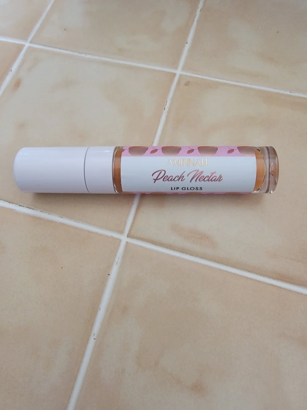 Aminnah Peach Nectar Lip Gloss.